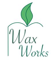 the words Wax Works framed with a thin green outline with a green flame representing the candle as well as it looks like a leaf to show we are an eco friendly company.